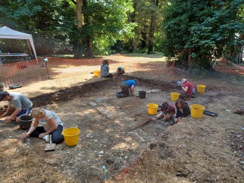 team of volunteers working on an archaeological dig