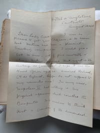 old letter unfolded on book