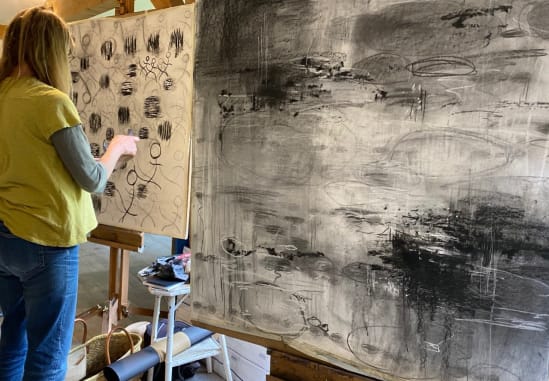 a student at work in front of an easel